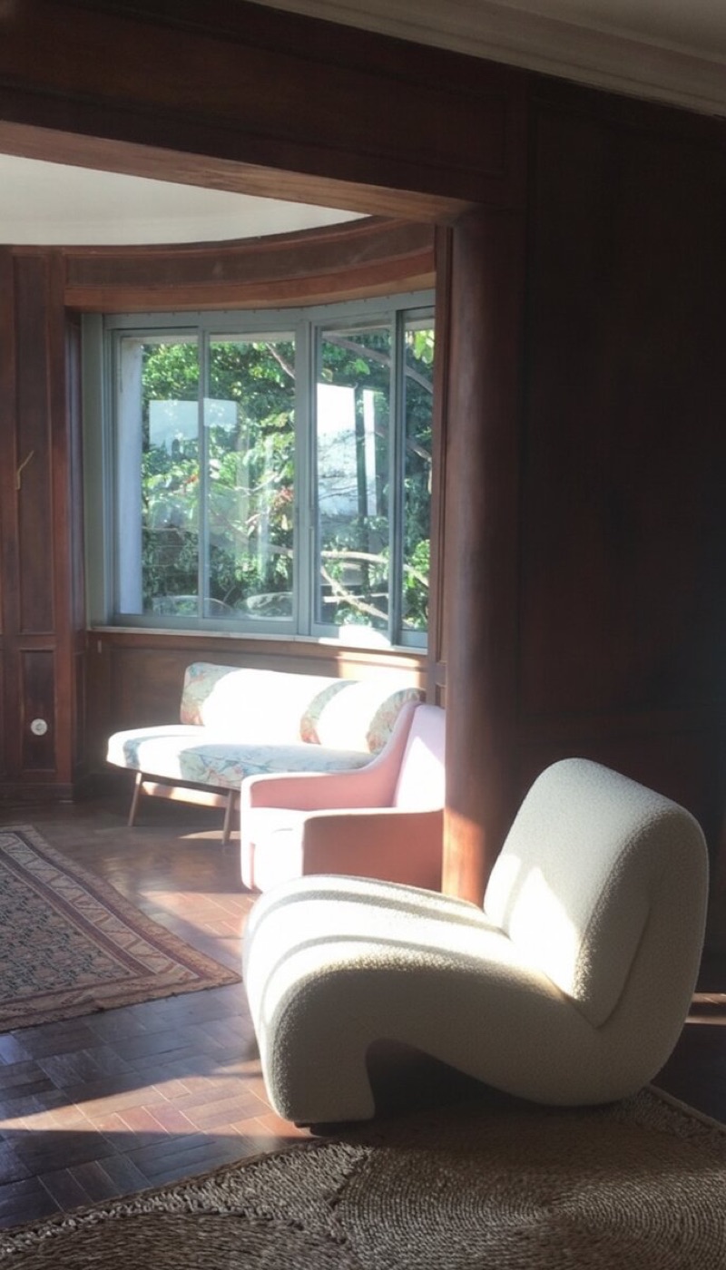 Same room with sofa reupholstered and an anchor chair added