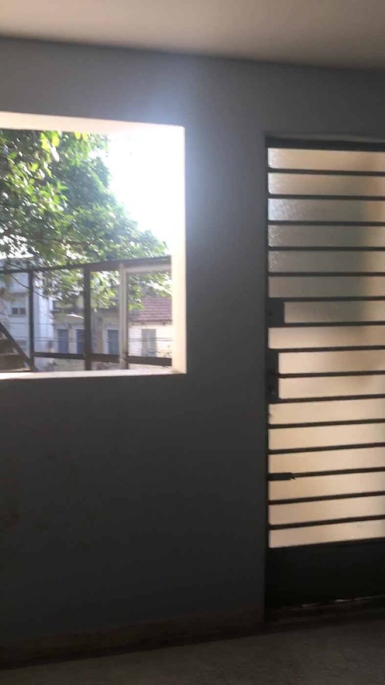 Adjoining corridor with a window and a frosted glass door
