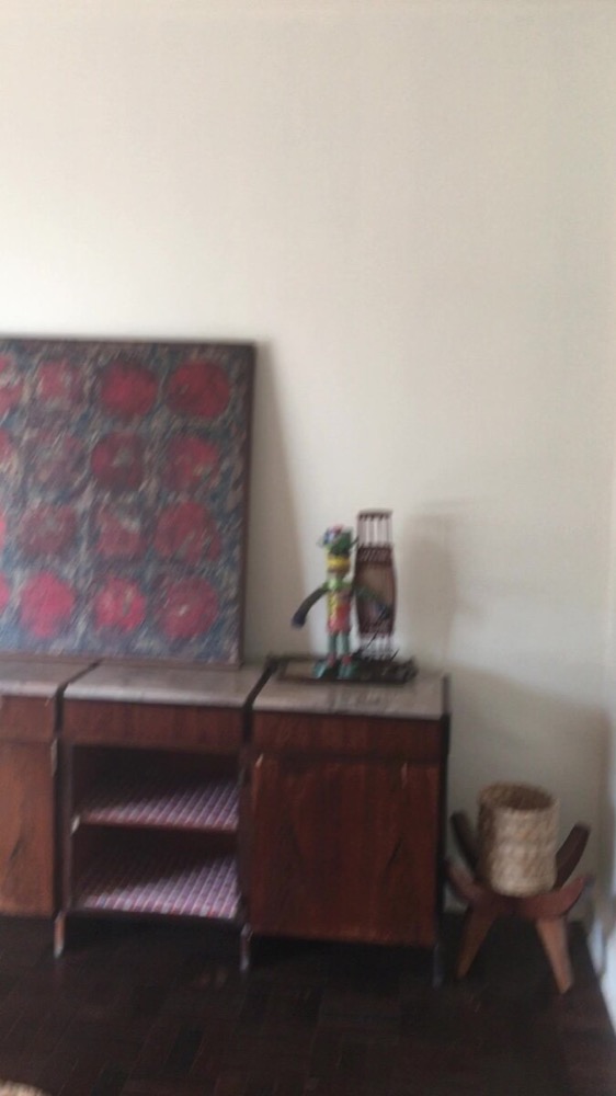 Adjoining hall with rosewood credenza and vintage painting