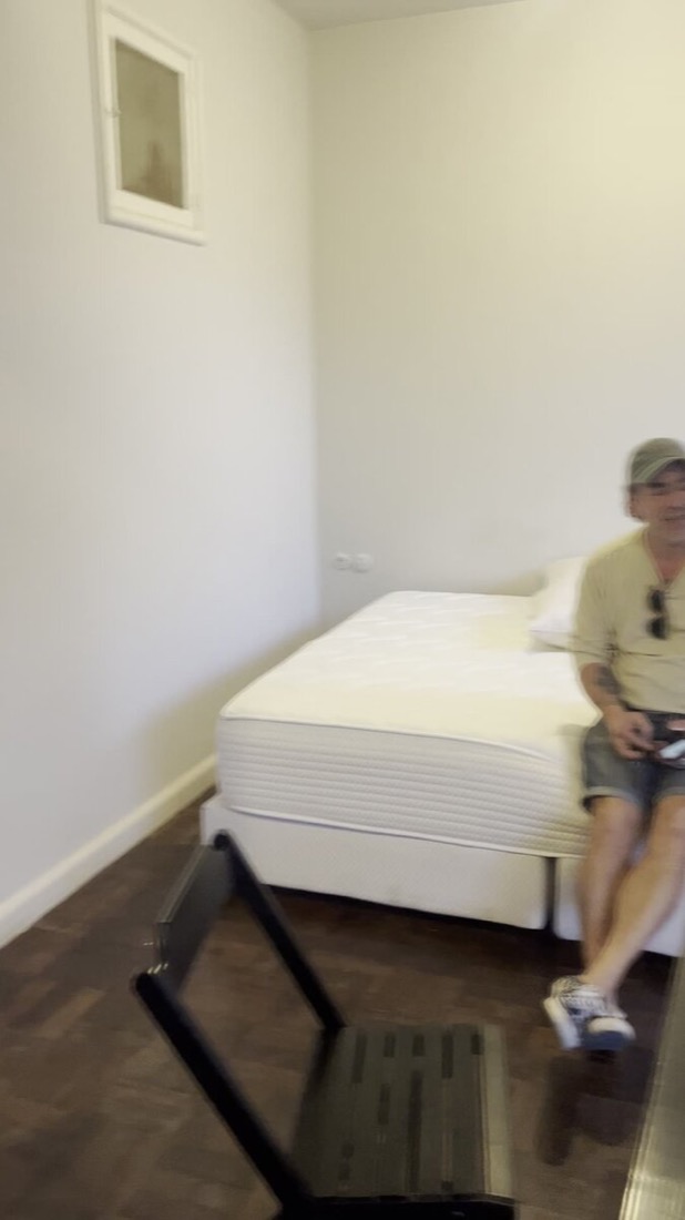 Bedroom furnished with only a bare mattress