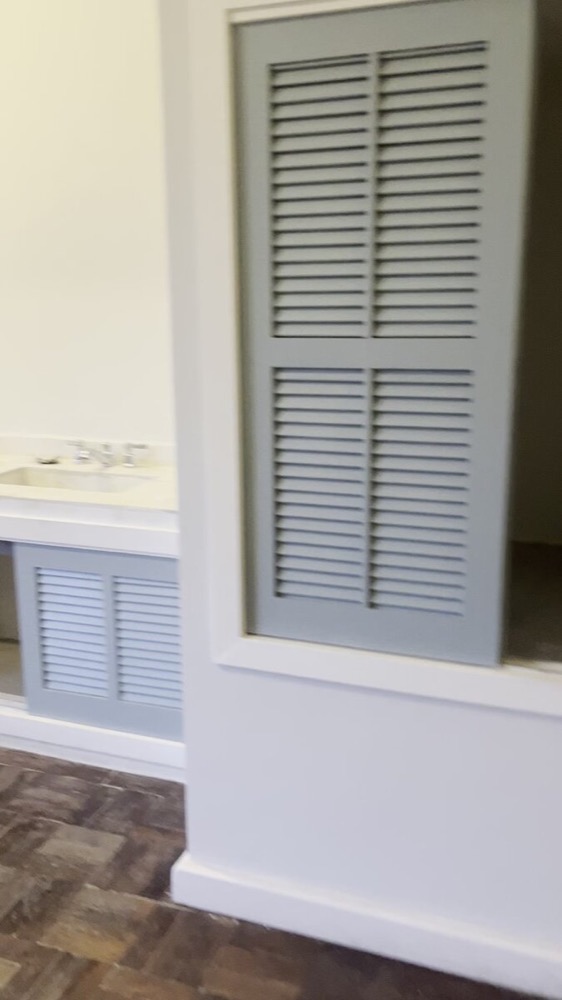Louvered bathroom vanity and cabinet