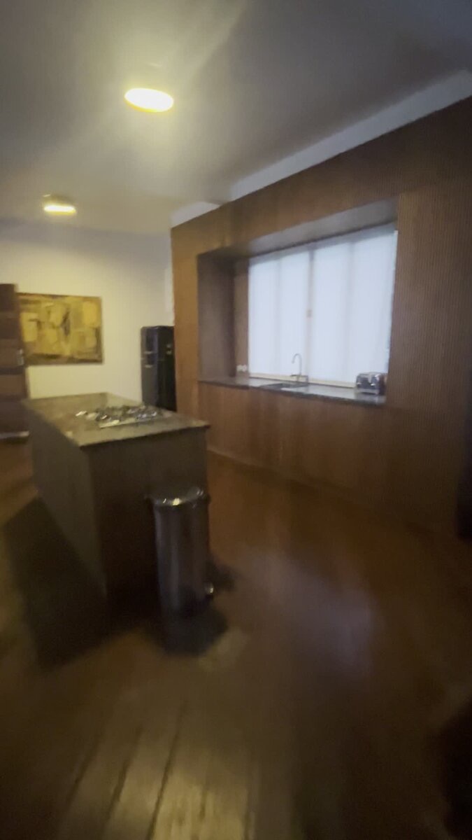 Open-plan walnut kitchen with island