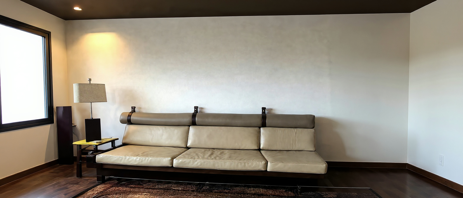 Long cream leather sofa in the penthouse living room