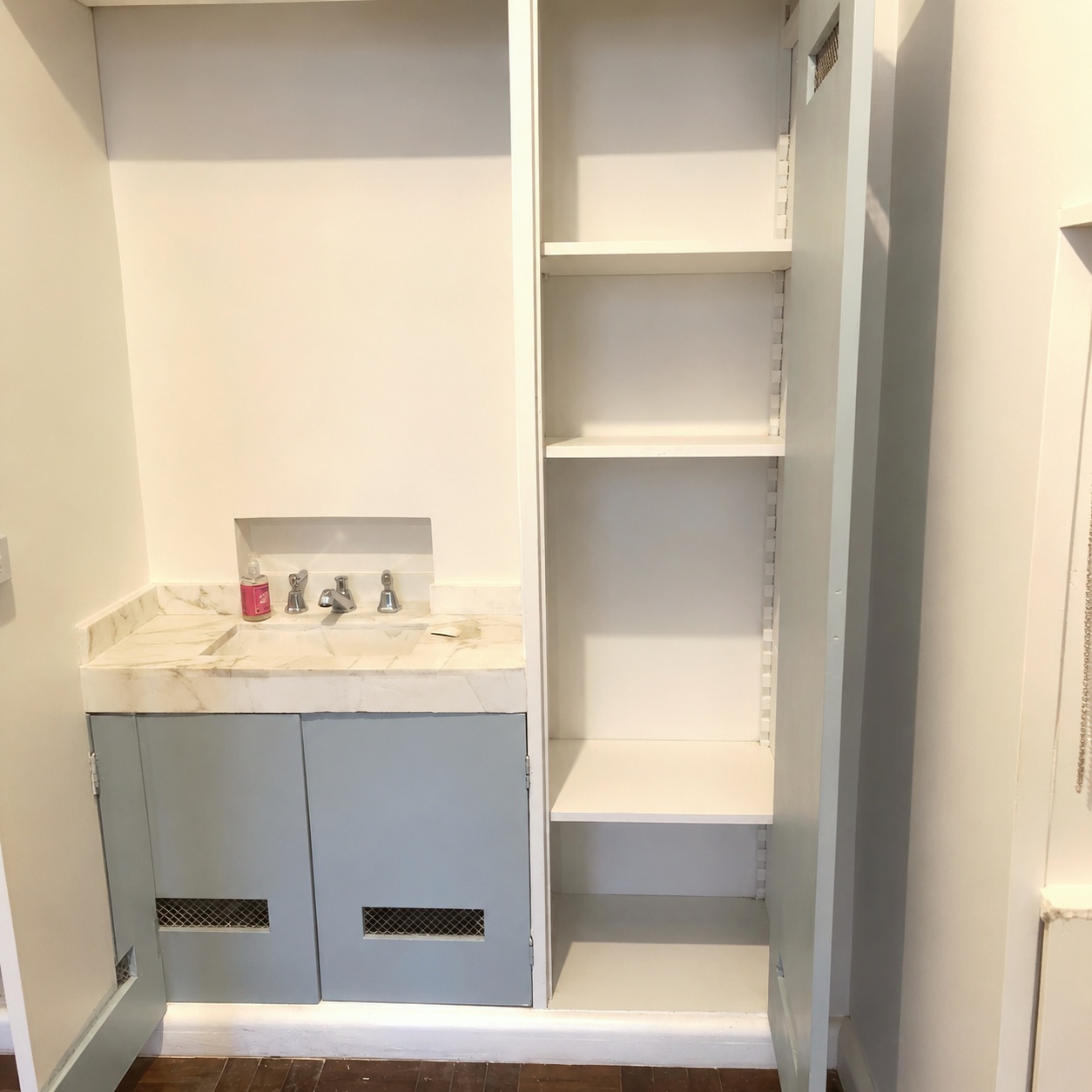 Sink and vanity with open shelving