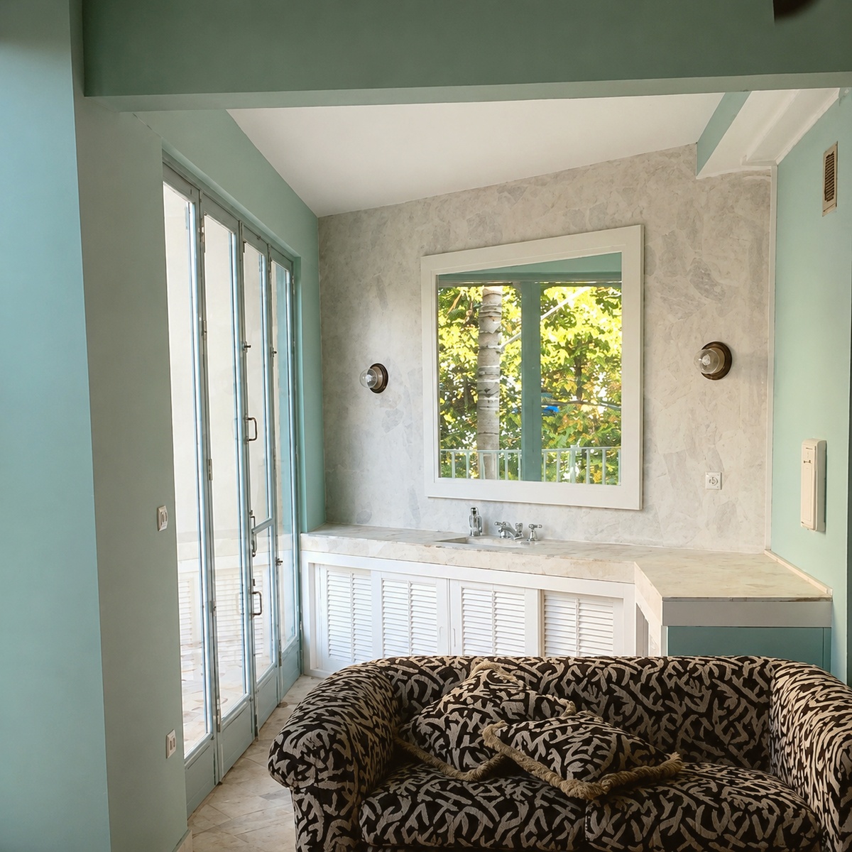 Kitchen counter, sink, and glass doors to outside